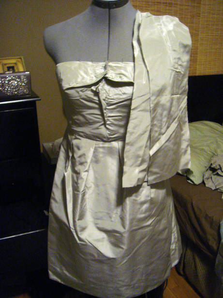 Roughly pinning together the new seams.  I'm totally self taught, so forgive me if my terminology is off or if my process it totally off or weird in any way.  But I think I still get good results.  Those two pieces of fabric pinned on the side will later become the bow for the bust.